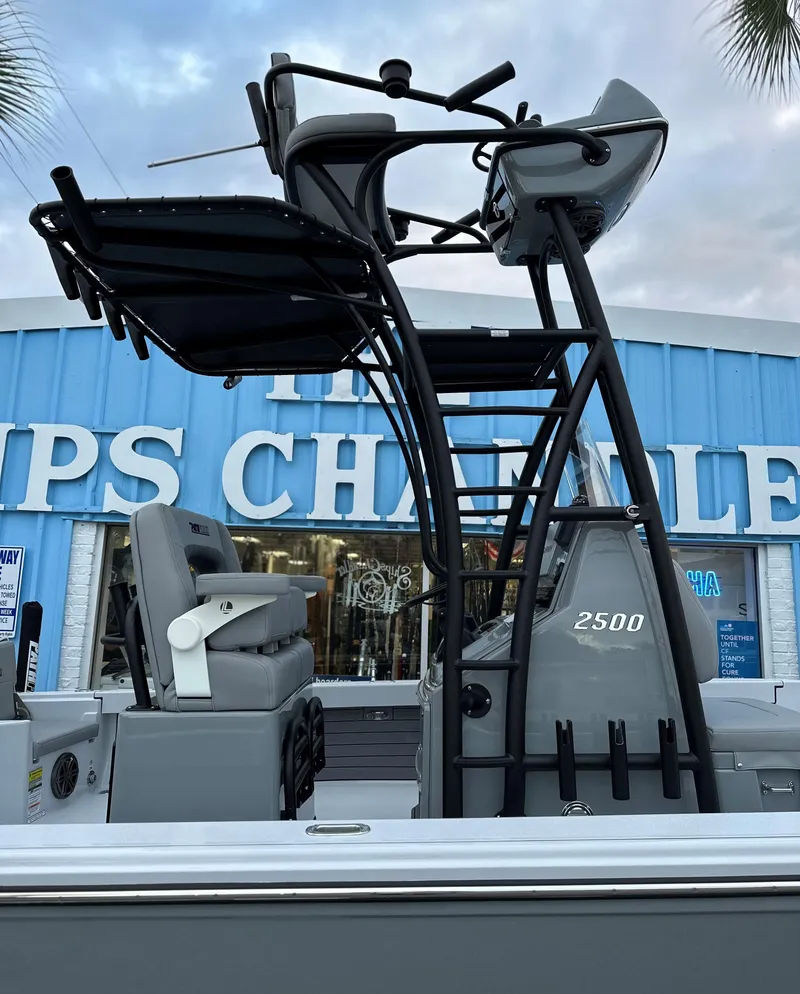 Slide: The Image of 2024 Pathfinder 2500 Hybrid boat at dealership. - 5