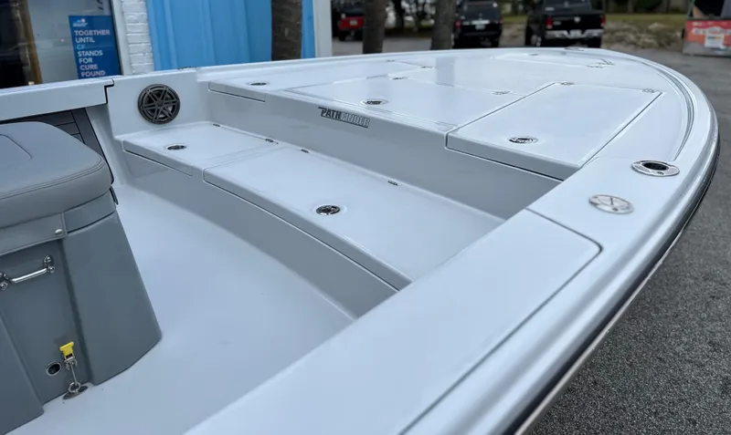 Slide: The Image of 2024 Pathfinder 2500 Hybrid boat deck with seating and storage compartments. - 7