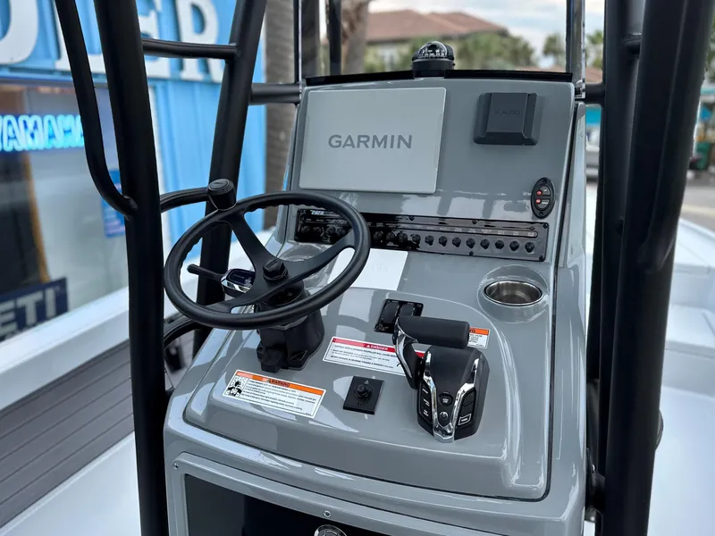 Slide: The Image of 2024 Pathfinder 2500 Hybrid boat console with Garmin navigation system. - 9