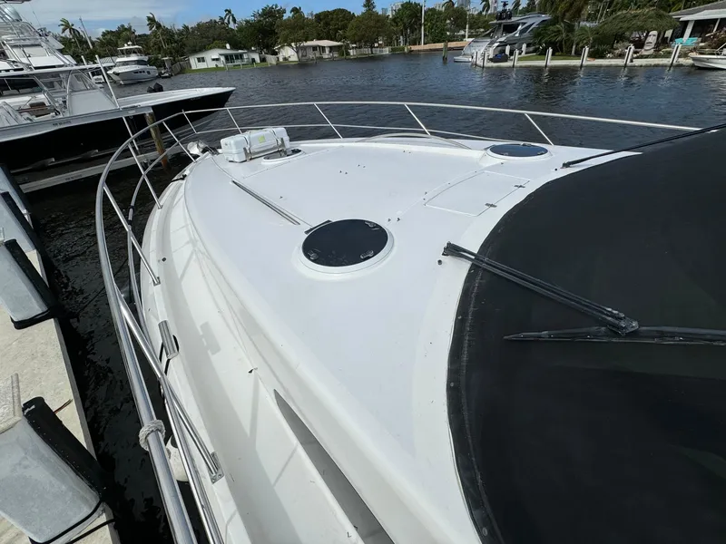 Slide: The Image of 2006 Neptunus 55 Cabrio yacht docked at a marina. - 10