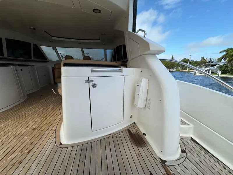 Slide: The Image of Interior view of 2006 Neptunus 55 Cabrio yacht with wooden deck and white cabinetry. - 19