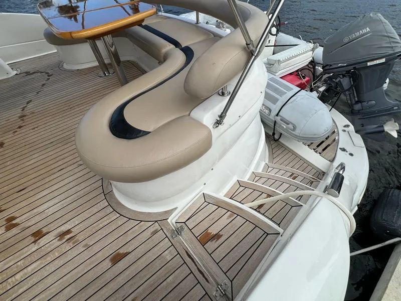 Slide: The Image of 2006 Neptunus 55 Cabrio yacht with teak deck and seating area. - 21