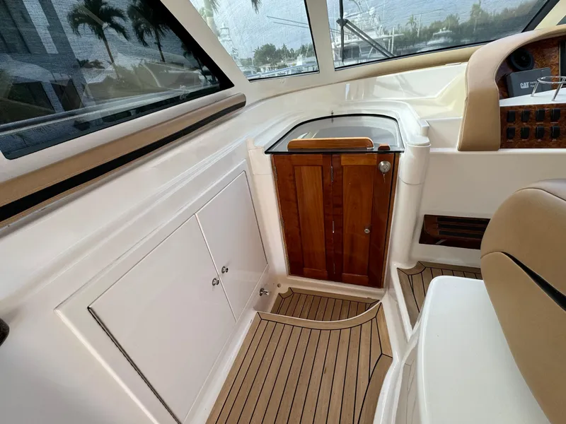 Slide: The Image of Interior of 2006 Neptunus 55 Cabrio yacht with wooden cabinetry and seating. - 29