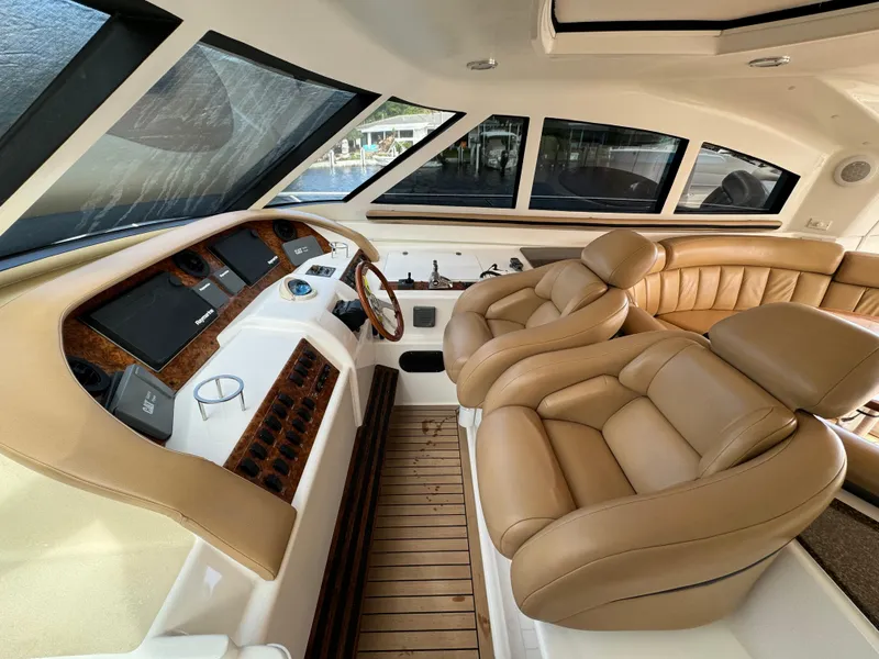 Slide: The Image of Interior of 2006 Neptunus 55 Cabrio yacht with tan leather seats and modern dashboard. - 31
