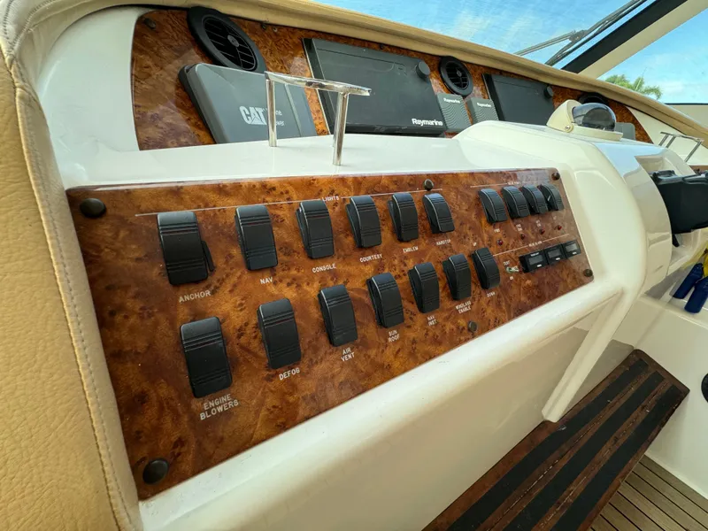 Slide: The Image of Control panel of a 2006 Neptunus 55 Cabrio yacht with various switches. - 34