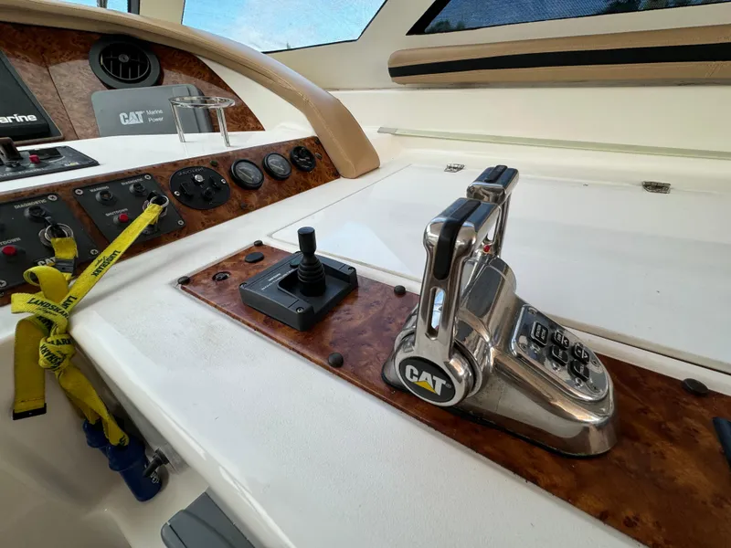 Slide: The Image of Control panel of a 2006 Neptunus 55 Cabrio yacht with CAT throttle. - 35