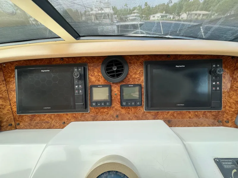 Slide: The Image of Dashboard of a 2006 Neptunus 55 Cabrio yacht with navigation screens. - 38