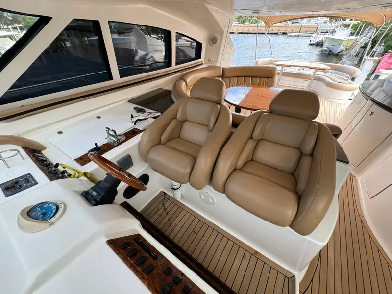 Slide: The Image of Luxurious interior of 2006 Neptunus 55 Cabrio yacht with leather seating and wooden accents. - 44