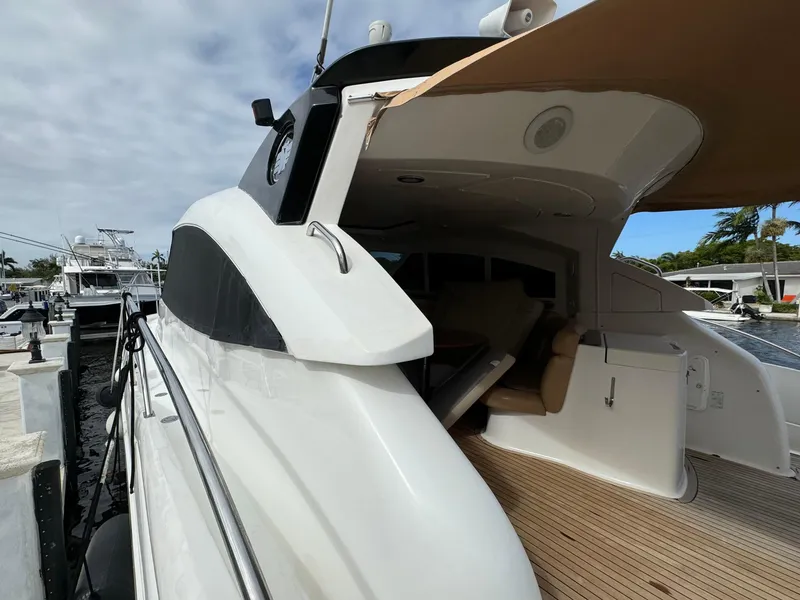 Slide: The Image of 2006 Neptunus 55 Cabrio yacht docked at marina, side view of deck and cabin. - 7