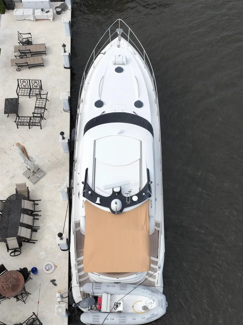 Slide: The Image of Aerial view of a 2006 Neptunus 55 Cabrio yacht docked beside a patio. - 9