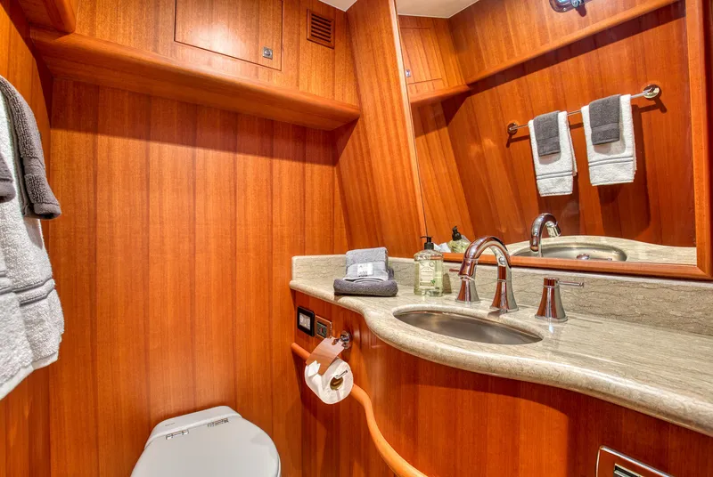 Slide: The Image of Luxurious bathroom in 2025 Hampton 750 Endurance LRC yacht with wood paneling and modern fixtures. - 11