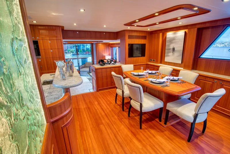 Slide: The Image of Luxurious interior of 2025 Hampton 750 Endurance LRC yacht with elegant dining area and modern decor. - 17