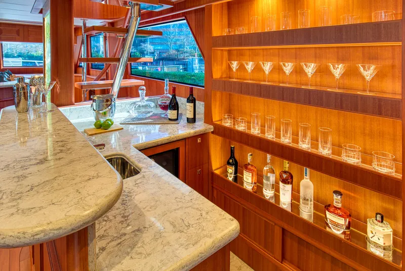 Slide: The Image of Luxurious bar area on 2025 Hampton 750 Endurance LRC yacht with marble countertop and glassware display. - 21