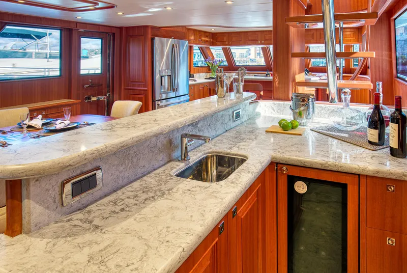 Slide: The Image of Luxurious interior of 2025 Hampton 750 Endurance LRC yacht with elegant kitchen and dining area. - 22