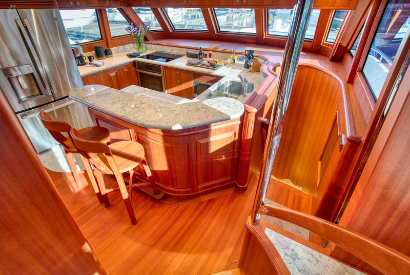 Slide: The Image of Luxurious kitchen interior of 2025 Hampton 750 Endurance LRC yacht with wooden finishes. - 23
