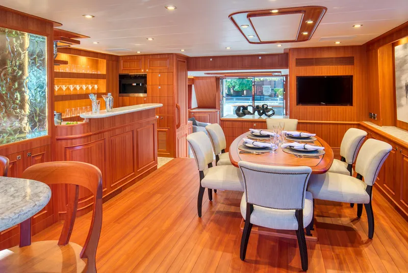 Slide: The Image of Luxurious interior of 2025 Hampton 750 Endurance LRC yacht with elegant dining area and bar. - 26