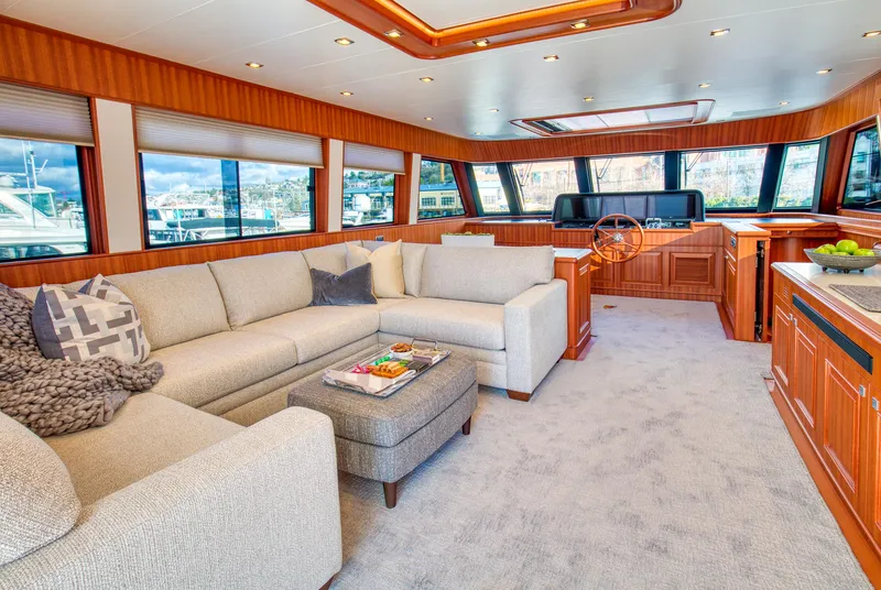 Slide: The Image of Luxurious interior of 2025 Hampton 750 Endurance LRC yacht with plush seating and panoramic windows. - 29