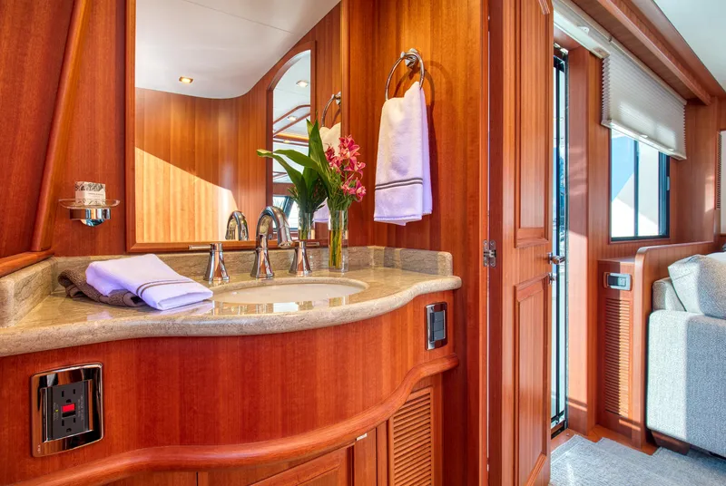 Slide: The Image of Luxurious bathroom interior of 2025 Hampton 750 Endurance LRC yacht with wooden finishes. - 32