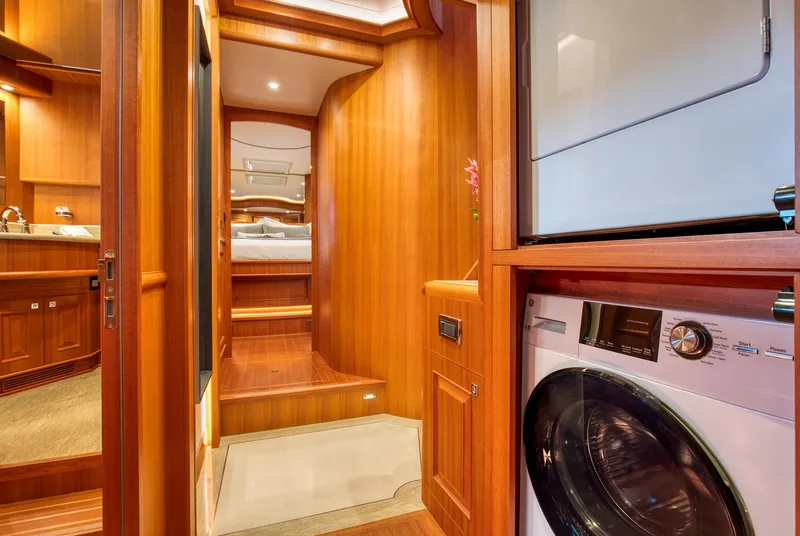Slide: The Image of Luxurious interior of 2025 Hampton 750 Endurance LRC yacht with wood finish and laundry area. - 34