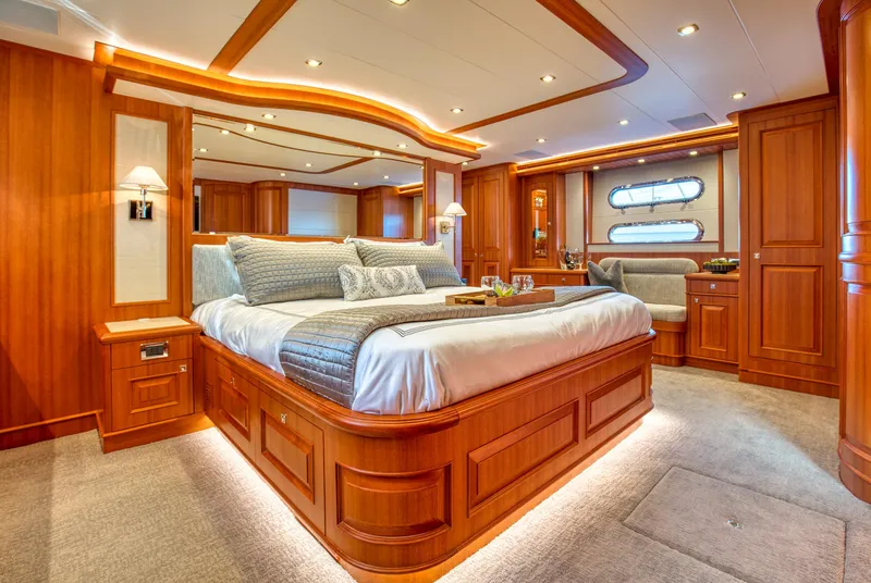 Slide: The Image of Luxurious bedroom interior of 2025 Hampton 750 Endurance LRC yacht with elegant wood finishes. - 36