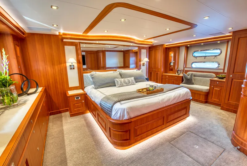 Slide: The Image of Luxurious bedroom interior of 2025 Hampton 750 Endurance LRC yacht with elegant wood finishes. - 37