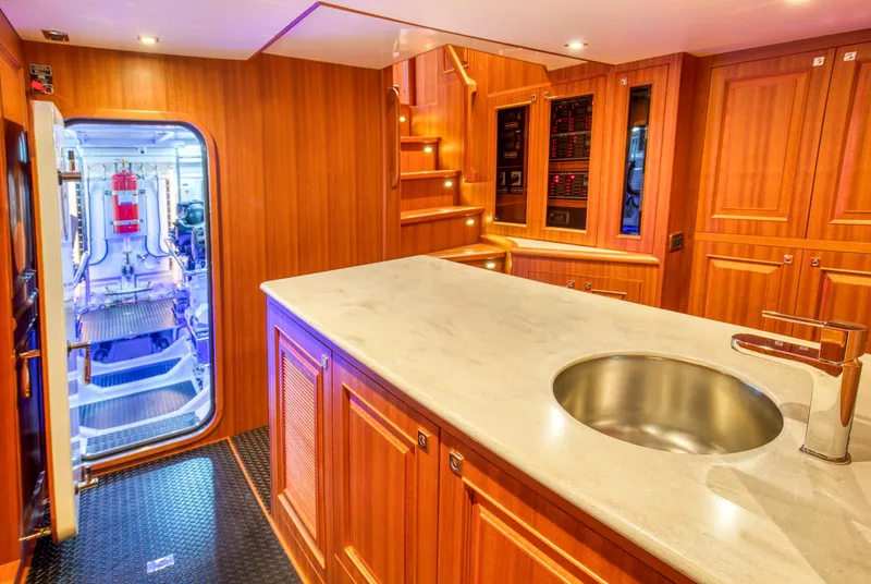 Slide: The Image of Luxurious interior of 2025 Hampton 750 Endurance LRC yacht with modern kitchen and engine room access. - 42