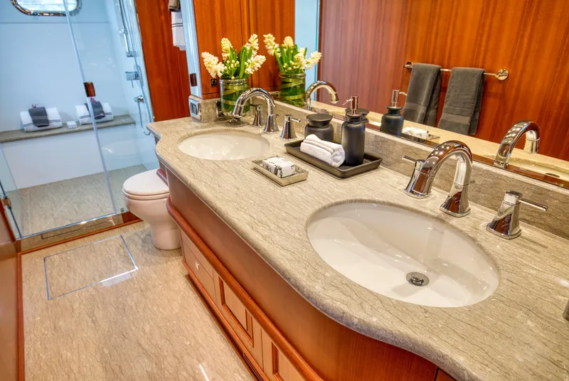 Slide: The Image of Luxurious bathroom in 2025 Hampton 750 Endurance LRC yacht with dual sinks and elegant decor. - 43