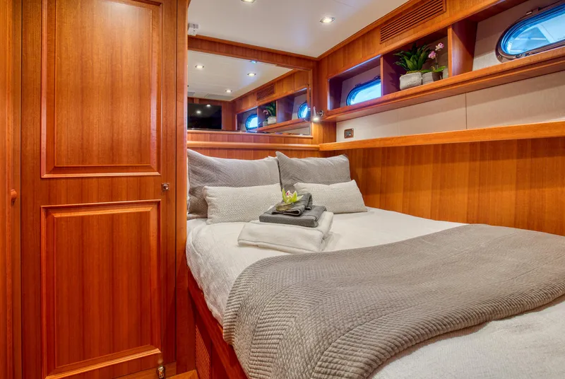 Slide: The Image of Luxurious bedroom interior of 2025 Hampton 750 Endurance LRC yacht with wood finish. - 45
