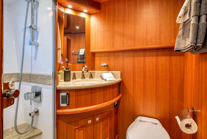 Slide: The Image of Luxurious bathroom in 2025 Hampton 750 Endurance LRC yacht with wood paneling and modern fixtures. - 47