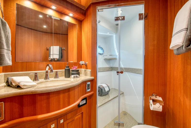 Slide: The Image of Luxurious bathroom in 2025 Hampton 750 Endurance LRC yacht with wood accents and modern fixtures. - 49