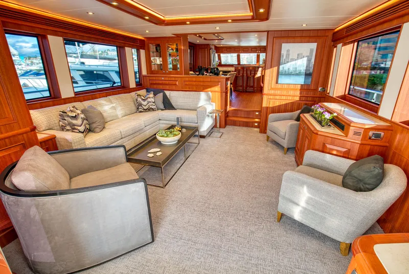 Slide: The Image of Luxurious interior of 2025 Hampton 750 Endurance LRC yacht with elegant seating and wood accents. - 7