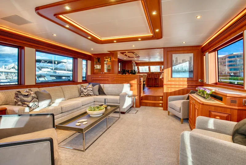 Slide: The Image of Luxurious interior of 2025 Hampton 750 Endurance LRC yacht with elegant seating and wood accents. - 8