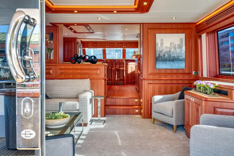 Slide: The Image of Luxurious interior of 2025 Hampton 750 Endurance LRC yacht with elegant wood finishes. - 9