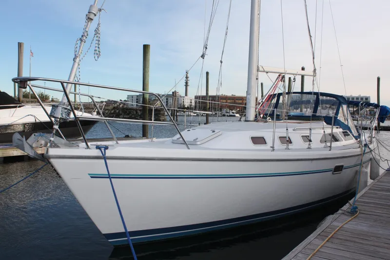 The Image of 1996 Catalina 34 MkII sailboat docked at marina, featuring sleek design and spacious deck. - 0