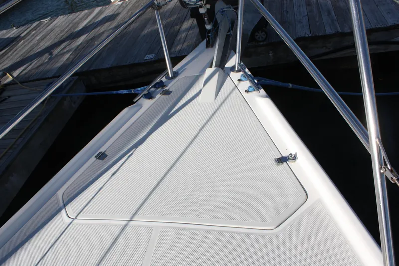 Slide: The Image of Bow of a 1996 Catalina 34 MkII sailboat docked at a marina. - 11