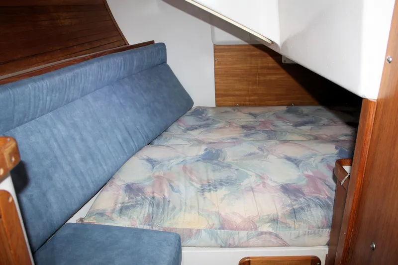 Slide: The Image of Cozy cabin interior of 1996 Catalina 34 MkII sailboat with cushioned seating and wooden accents. - 18