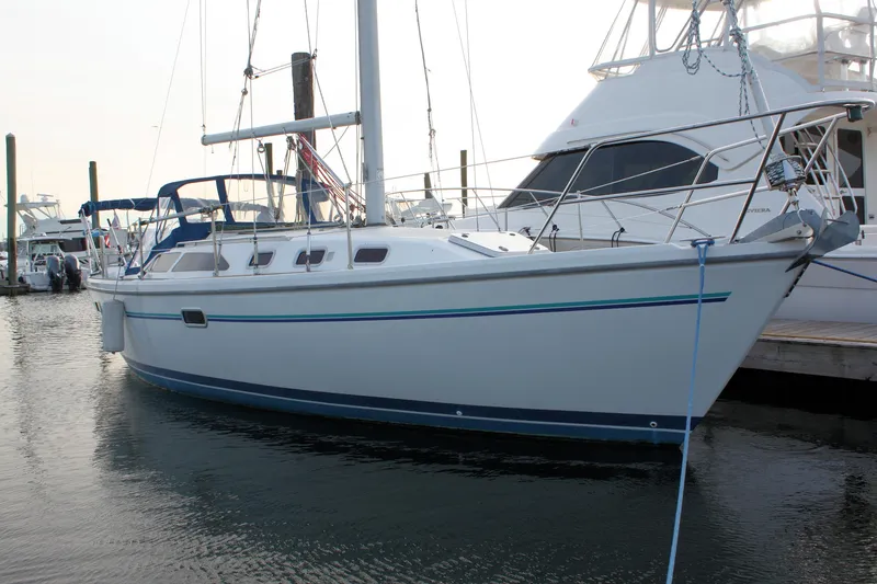 Slide: The Image of 1996 Catalina 34 MkII sailboat docked at marina, side view. - 2