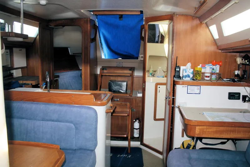 Slide: The Image of Interior of a 1996 Catalina 34 MkII sailboat with wood finishes and blue upholstery. - 29