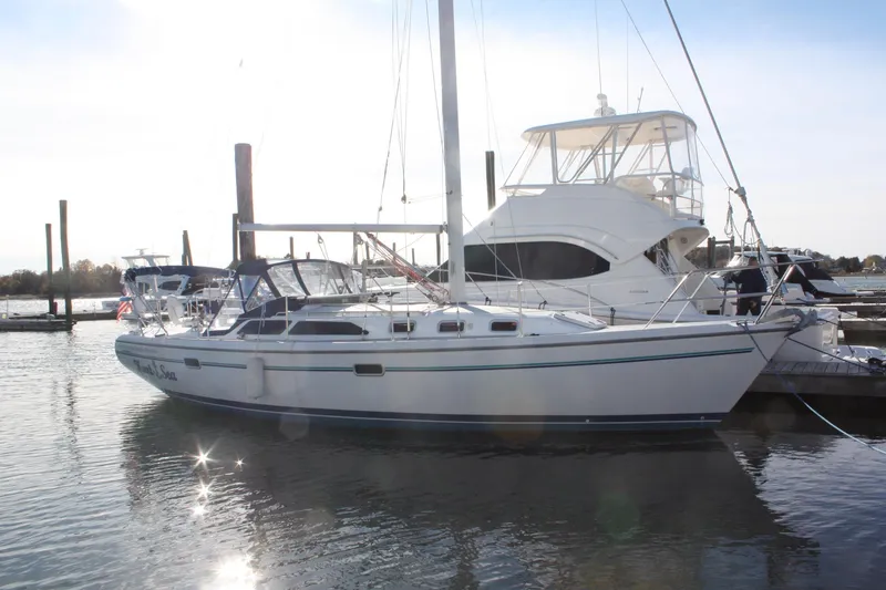 Slide: The Image of 1996 Catalina 34 MkII sailboat docked in a marina, side view. - 4