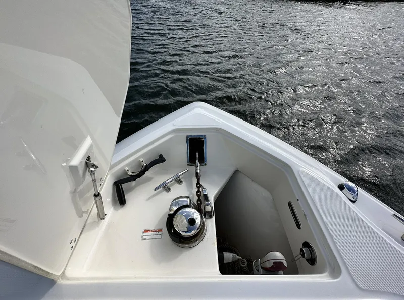 Slide: The Image of 2014 Boston Whaler 280 Outrage anchor locker with anchor and chain. - 23