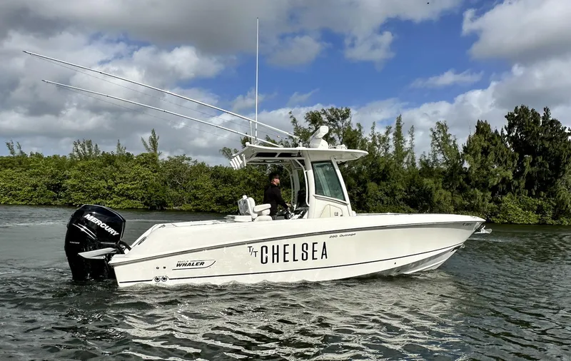 Slide: The Image of 2014 Boston Whaler 280 Outrage boat named Chelsea cruising on a river. - 6