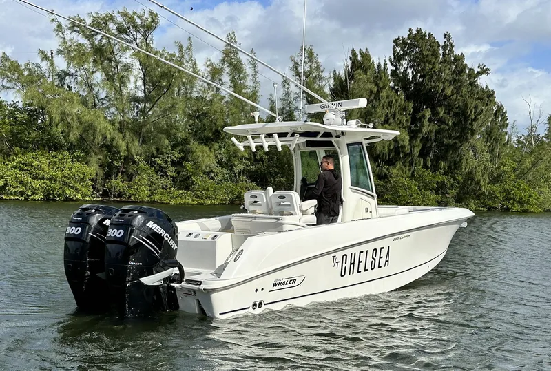 Slide: The Image of 2014 Boston Whaler 280 Outrage boat on water with twin Mercury 300 engines. - 7