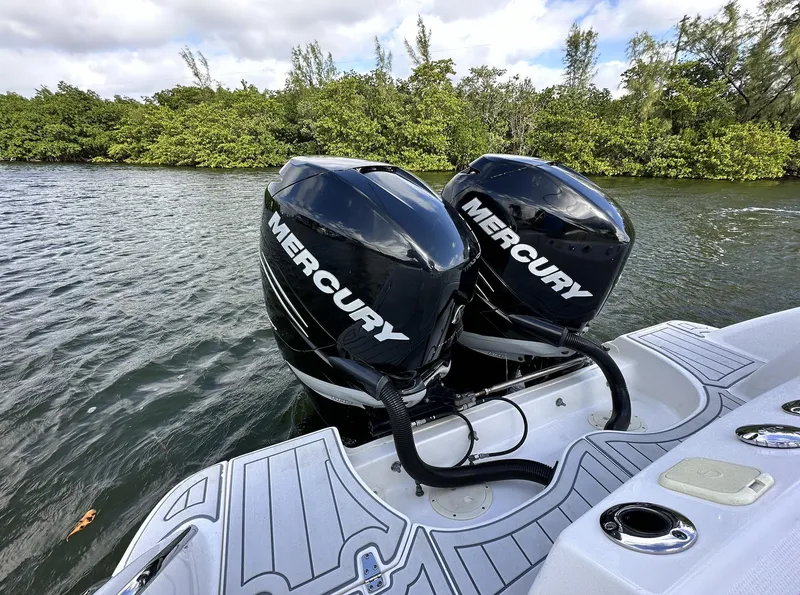Slide: The Image of 2014 Boston Whaler 280 Outrage with twin Mercury outboard engines on water. - 9