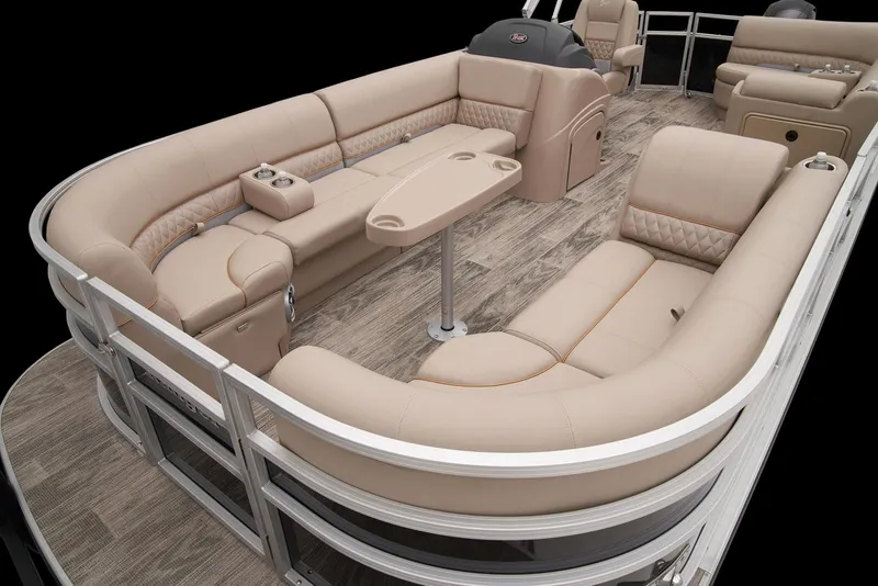 Slide: The Image of 2024 Ranger Reata 220C pontoon boat with luxurious beige seating and wood flooring. - 14