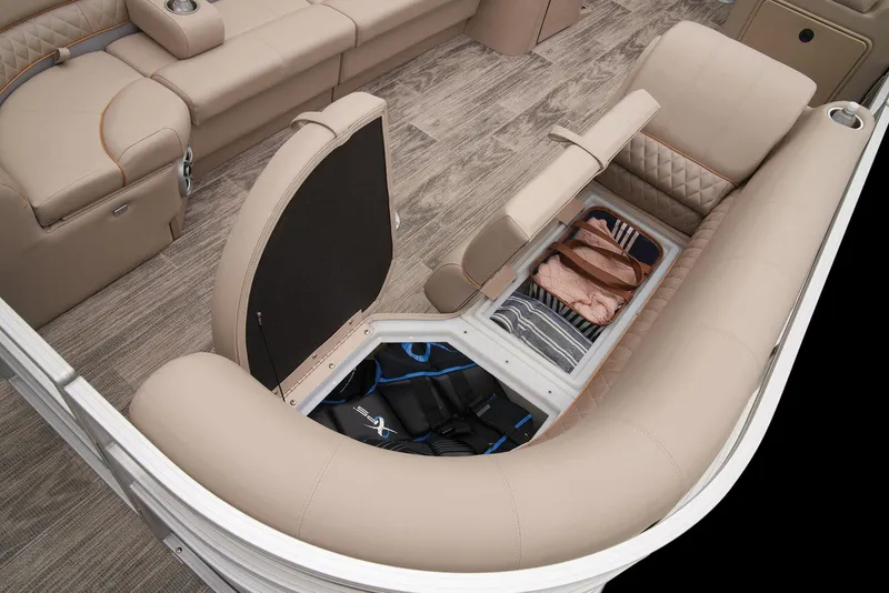 Slide: The Image of 2024 Ranger Reata 220C boat interior with under-seat storage and beige upholstery. - 16