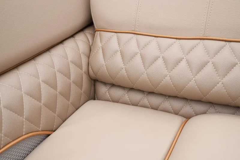 Slide: The Image of 2024 Ranger Reata 220C beige quilted leather upholstery detail. - 43