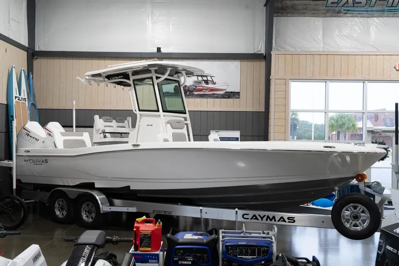 The Image of 2024 Caymas 281 HB boat on trailer in showroom. - 1