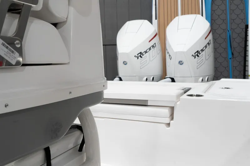 Slide: The Image of 2024 Caymas 281 HB boat with dual Racing outboard engines. - 13