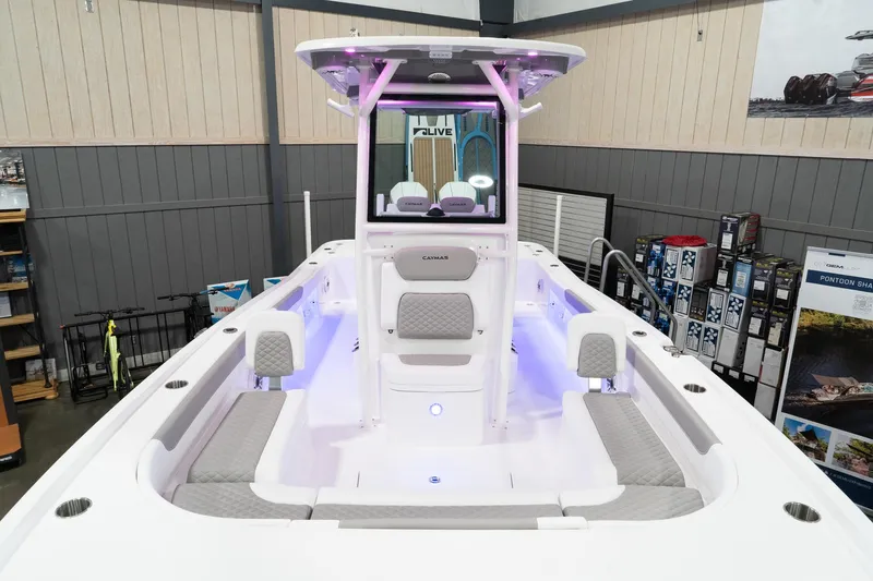 Slide: The Image of 2024 Caymas 281 HB boat interior with LED lighting in showroom. - 17