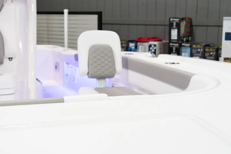 Slide: The Image of 2024 Caymas 281 HB boat interior with cushioned seating and modern design. - 19